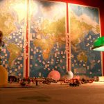 a world map wall with pieces of paper pinned to it and toys on a table in front of it