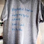 grey t-shirt with the slogan 'Psychiatrist tried to make me go to nuthouse. And I said no no no....'