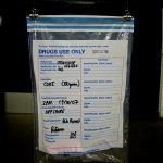 police drugs evidence bag with hand written notes to identify contents etc