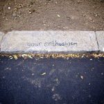 'your enthusiasm' hand written on a curb
